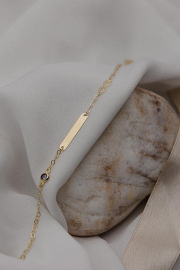 Χρυσή ταυτότητα Κ9 με μωβ πέτρα και άπειρο